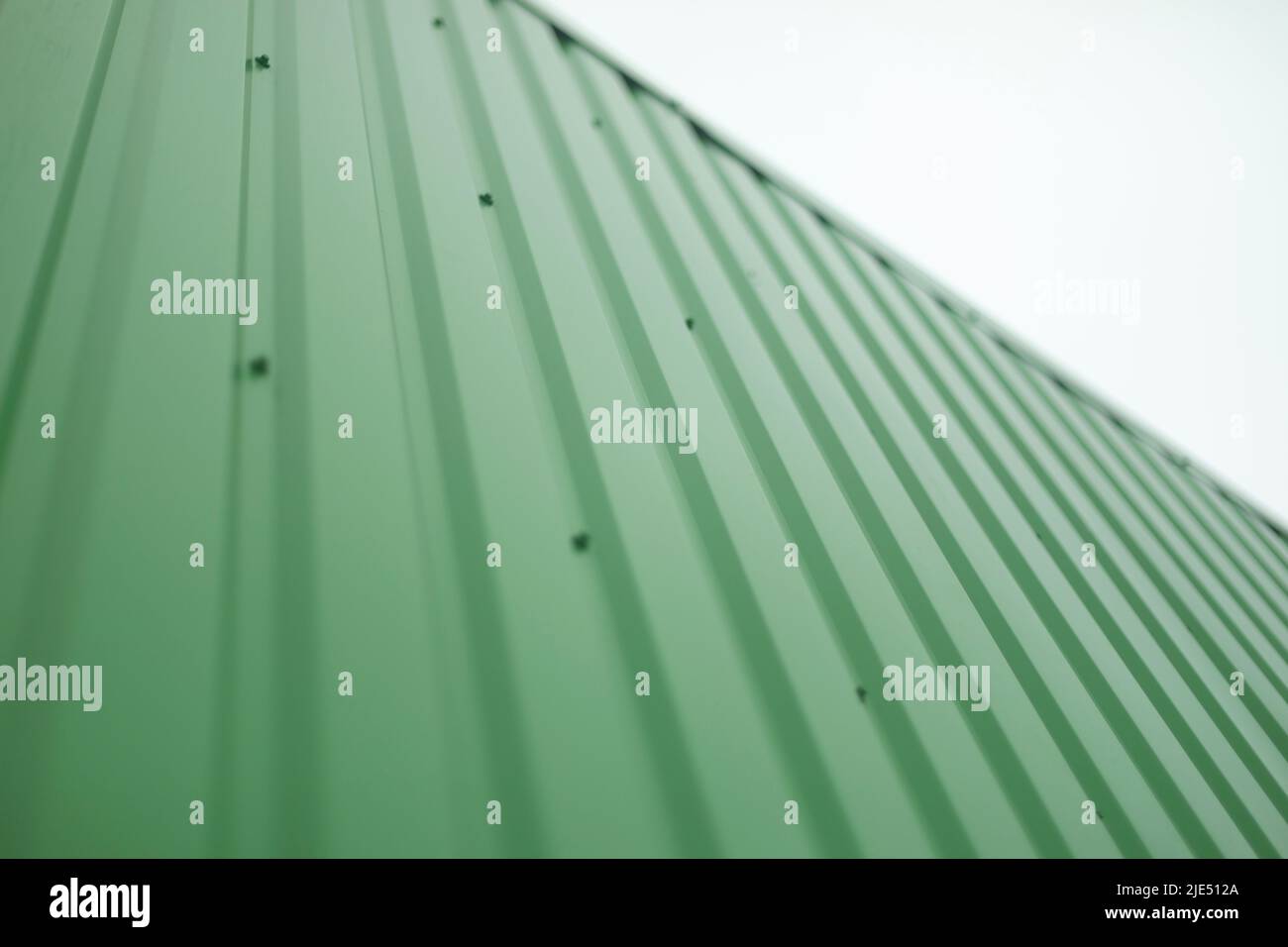 Green steel wall. Details of cladding of building. Steel profile Stock