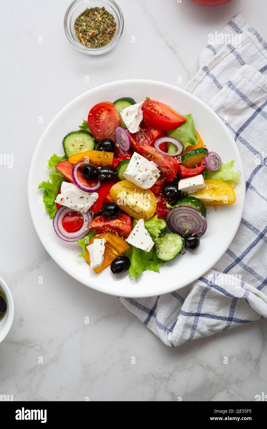 Fresh Greek salad o white plate top view Stock Photo