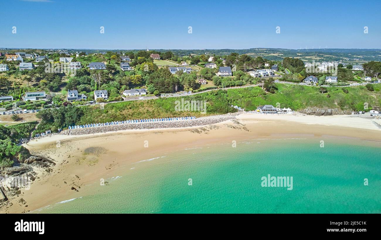 Image of Carteret beach with sand, sunshine, beach huts and a blue sky. Stock Photo