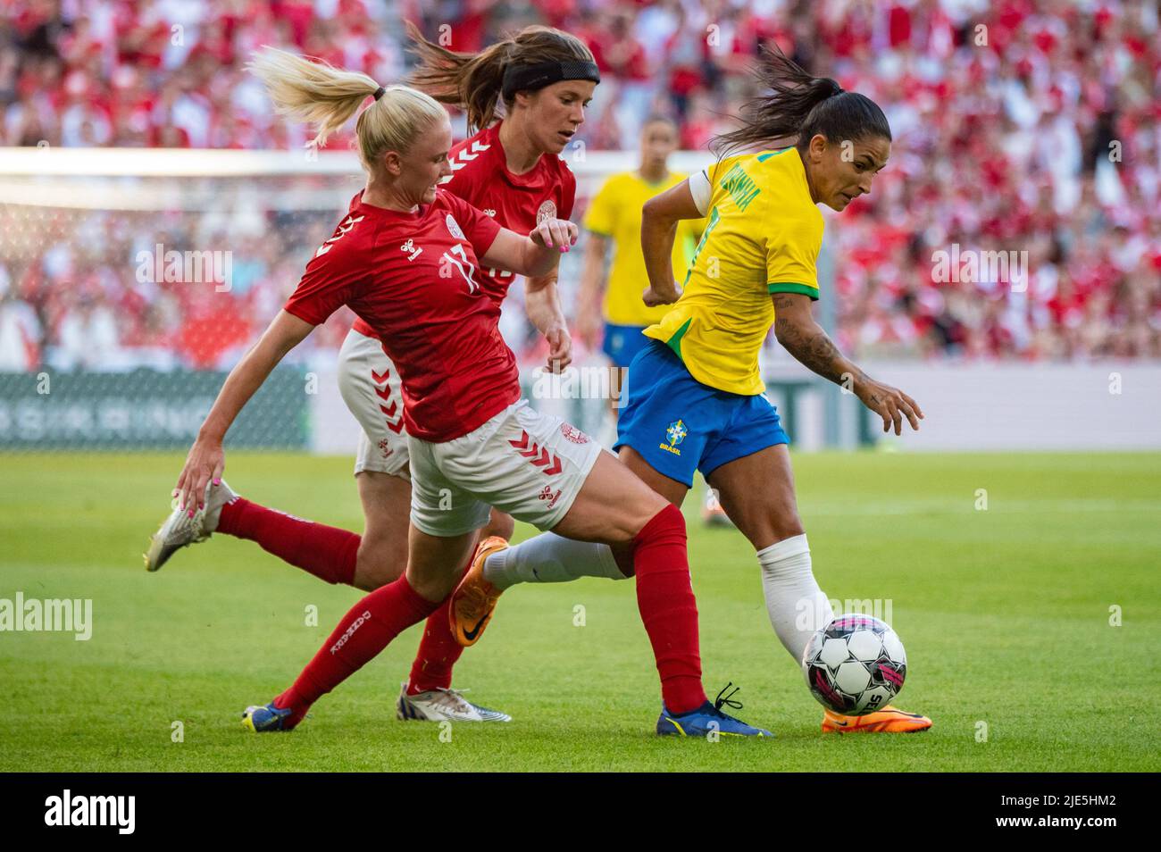 Copenhagen, Denmark. 24th June, 2022. Debinha (9) of Brazil and Rikke Marie Madsen (17) and Sofie Pedersen of Denmark seen during the football friendly between Denmark and Brazil at Parken in Copenhagen. (Photo Credit: Gonzales Photo/Alamy Live News Stock Photo