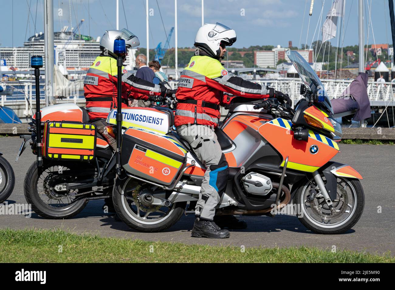 two men of the Johanniter motorcycle squadron at the Kiellinie in Kiel, Germany Stock Photo