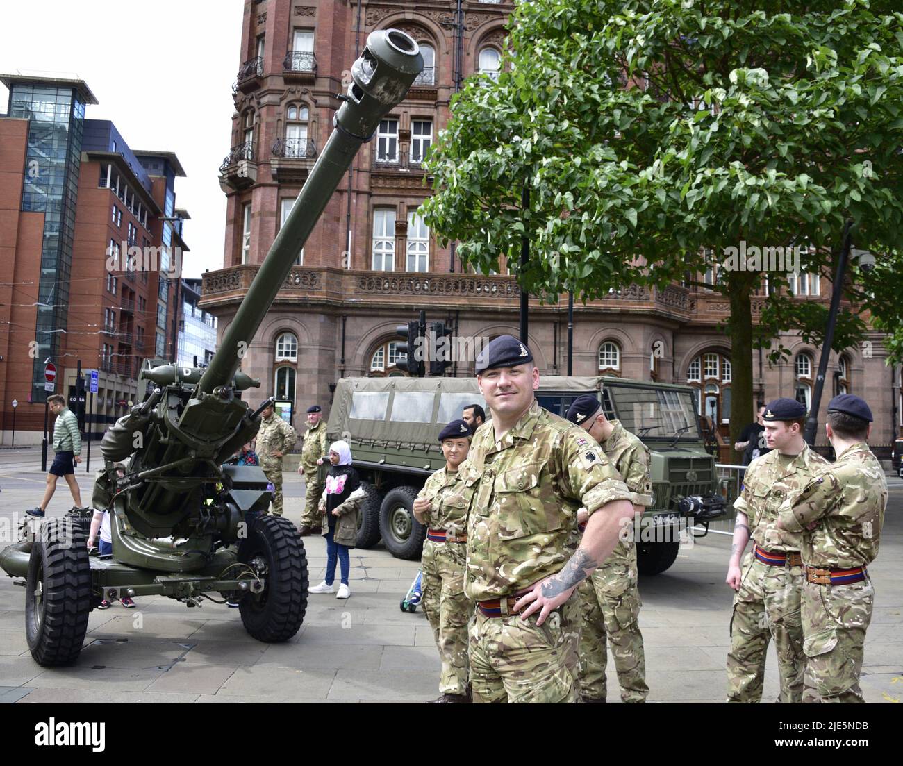Manchester, UK, 25th June, 2022. Soldiers pose with an Ll18, 105 mm artillery gun. Armed Forces Day is celebrated in St Peter's Square, Manchester, England, United Kingdom, British Isles.  Credit: Terry Waller/Alamy Live News Stock Photo
