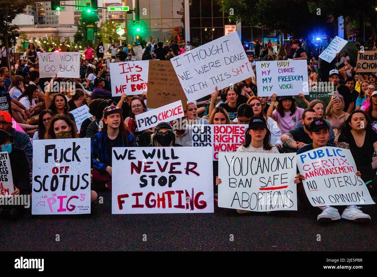 Reno, United States. 24th June, 2022. (Editors note image depicts profanity) Protesters sit to close a public road during Scotus protest. Protestors gather after SCOTUS over turned Roe v. Wade. Credit: SOPA Images Limited/Alamy Live News Stock Photo