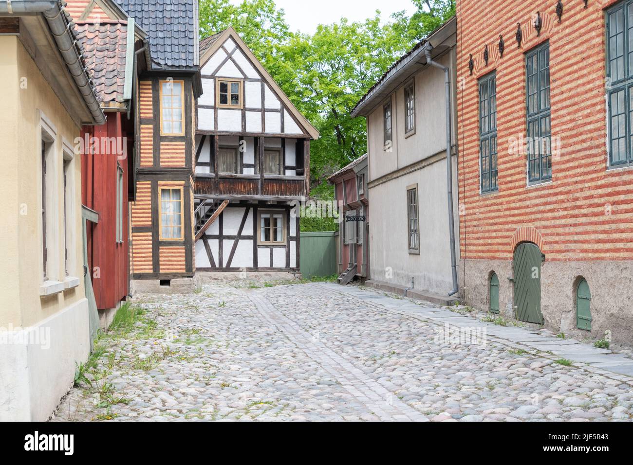 Cobblestone street and old buildings at The Norwegian Museum of Cultural History in Oslo. Stock Photo