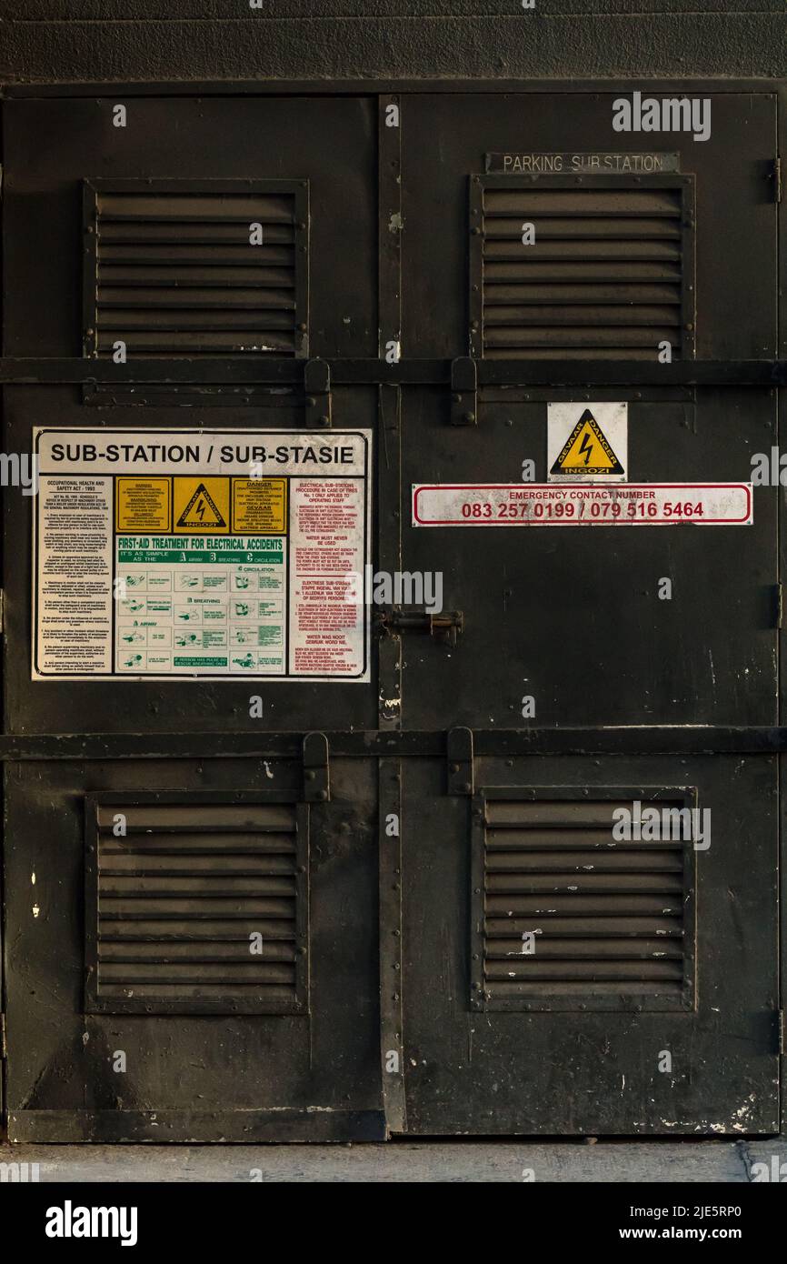 Electrical substation or sub station closeup in South Africa concept technology and infrastructure showing first aid emergency treatment sign Stock Photo