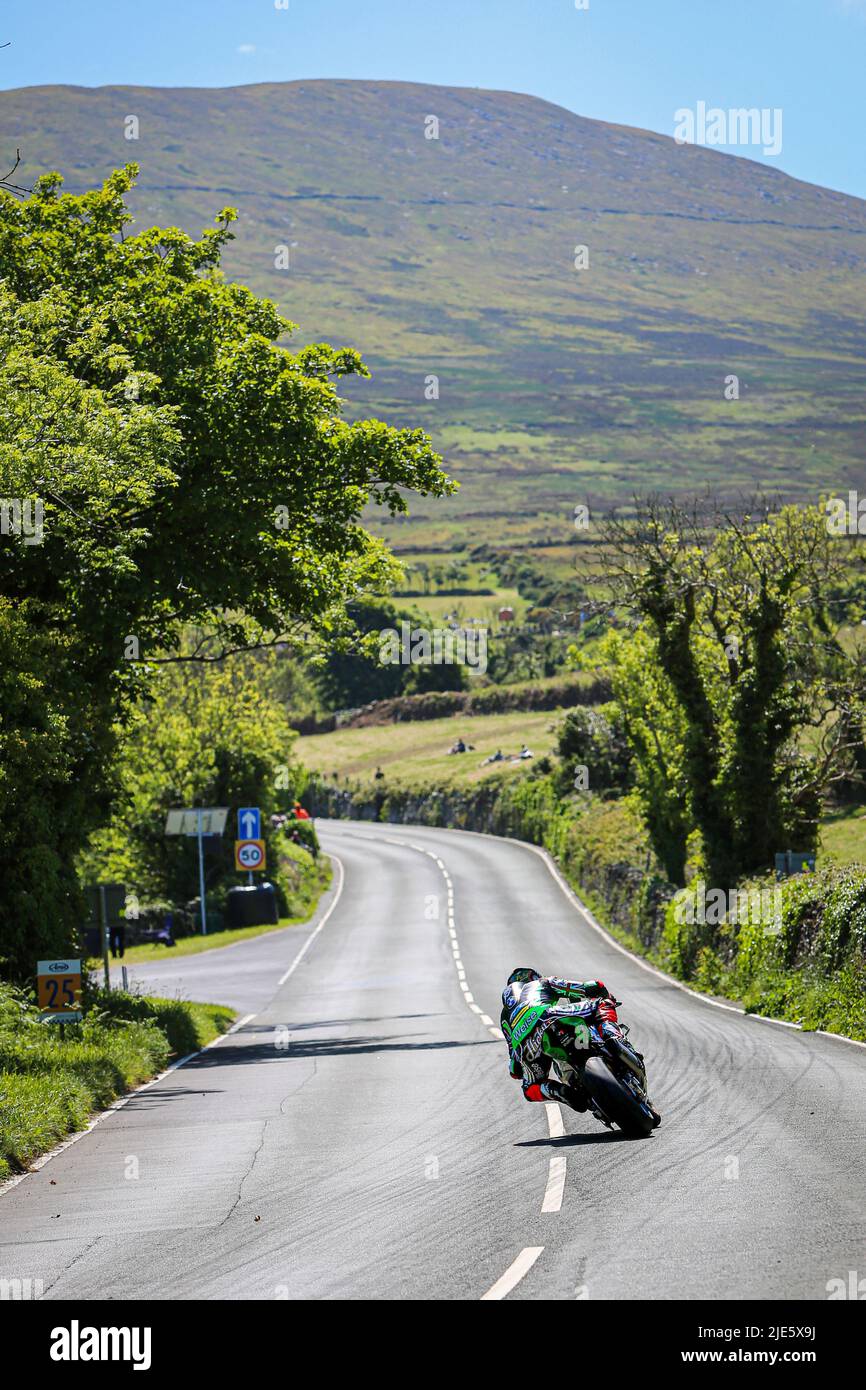 Peter Hickman climbs from Tower Bends to the Gooseneck on the final lap of the 2022 Superbike TT race in the Isle of Man on his FHO Racing BMW Stock Photo