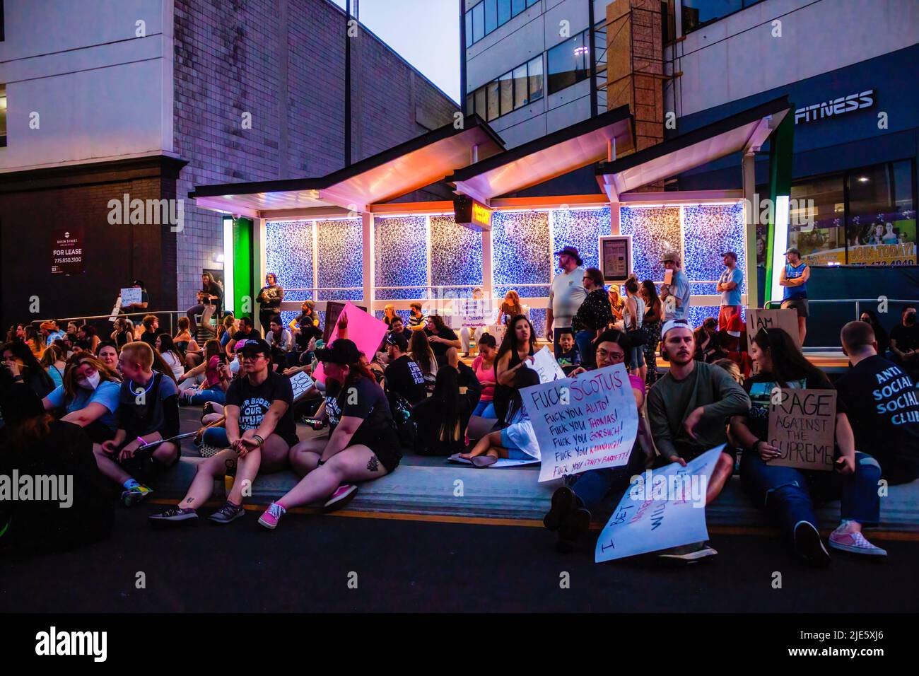 Reno, United States. 24th June, 2022. Protesters sit to close a public road near a bus stop during Scotus protest. Protestors gather after SCOTUS over turned Roe v. Wade. (Photo by Ty ONeil/SOPA Images/Sipa USA) Credit: Sipa USA/Alamy Live News Stock Photo