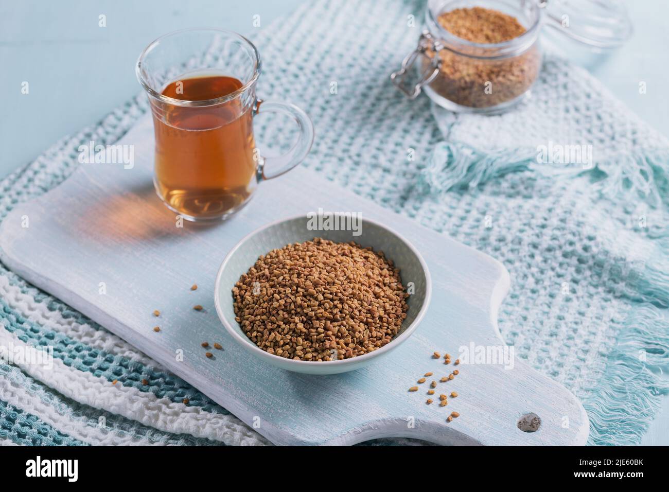 Bowl of fenugreek seeds and Egyptian fenugreek yellow tea or Methi Dana