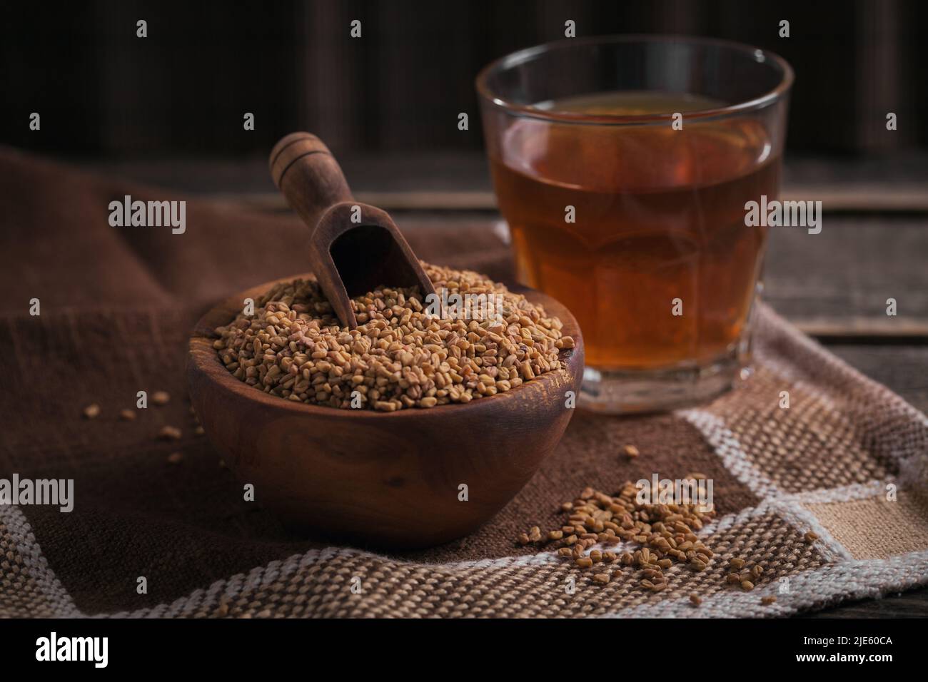 Bowl of fenugreek seeds and Egyptian fenugreek yellow tea or Methi Dana