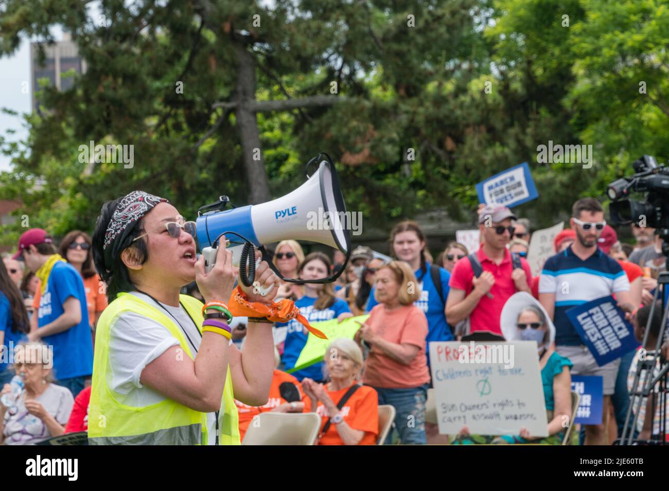 Activist speaks at March for Our Lives Protest Rally in Boston, Massachusetts, US. Protesters holding anti-gun signs calling  for gun legislation. Stock Photo