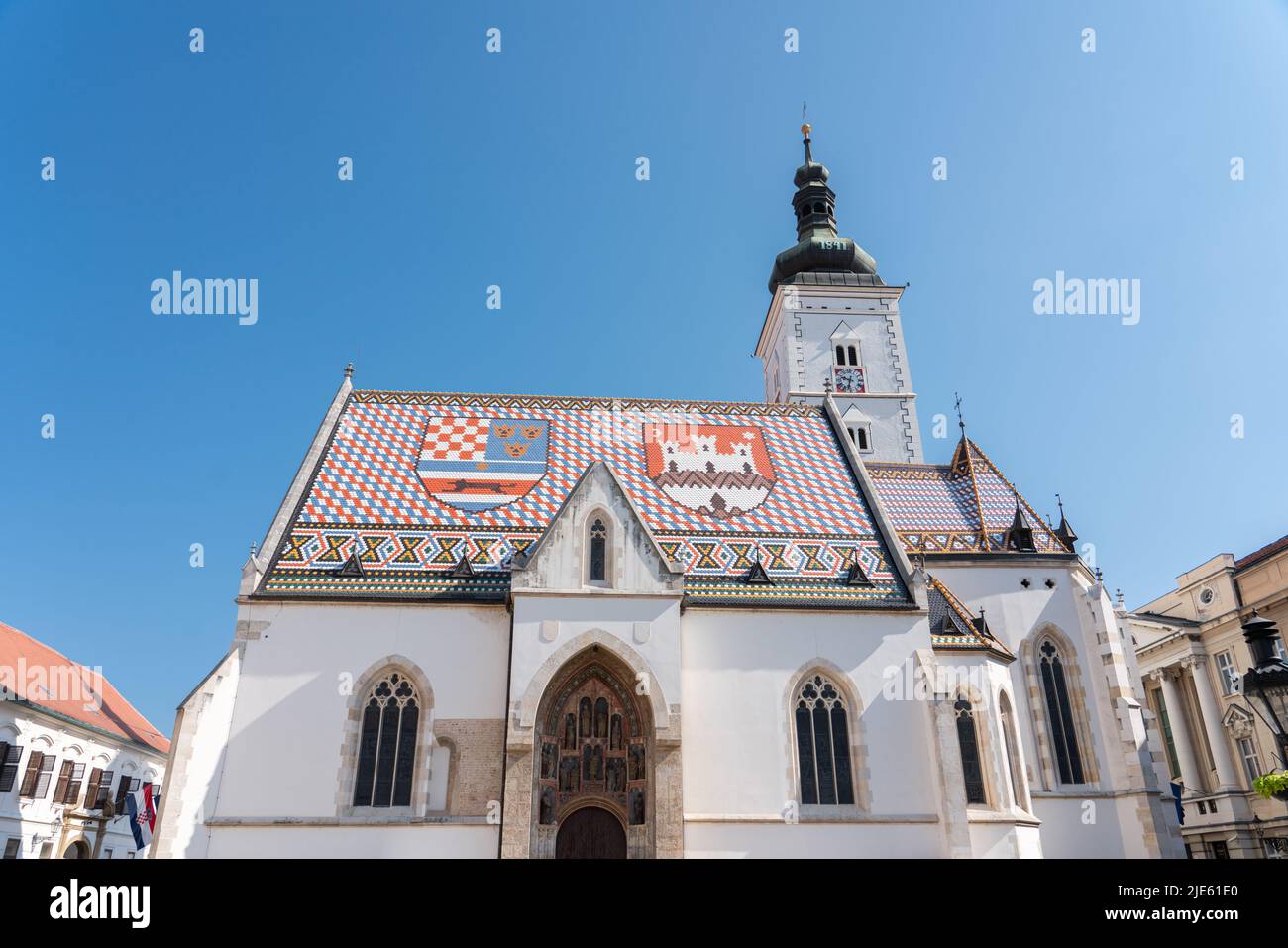 ZAGREB, CROATIA - JULY 29, 2021: Saint Mark’s Church uniquely colorful tiled roof makes it a Zagreb icon and it is one of the oldest buildings in the Stock Photo
