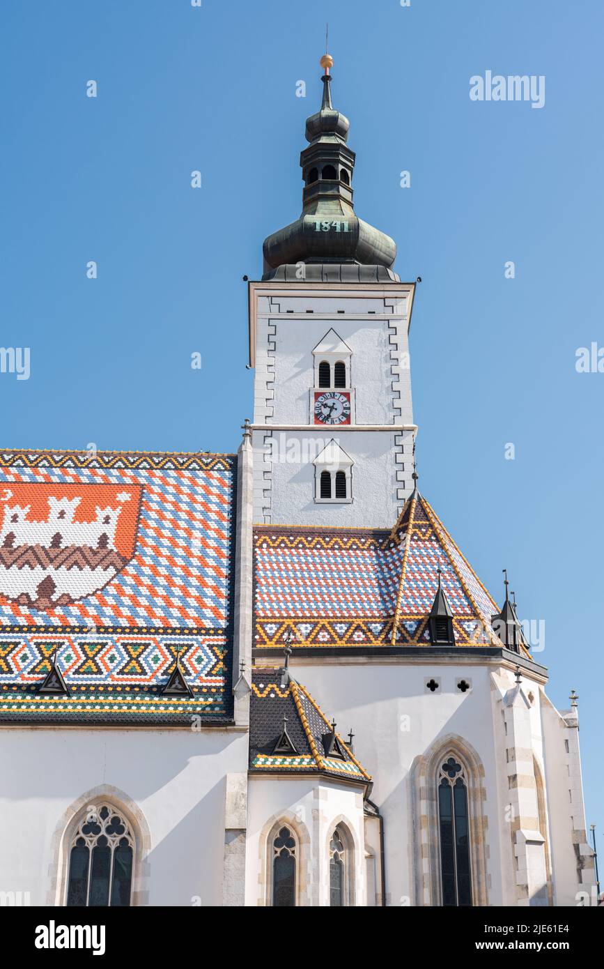 ZAGREB, CROATIA - JULY 29, 2021: Saint Mark’s Church uniquely colorful tiled roof makes it a Zagreb icon and it is one of the oldest buildings in the Stock Photo