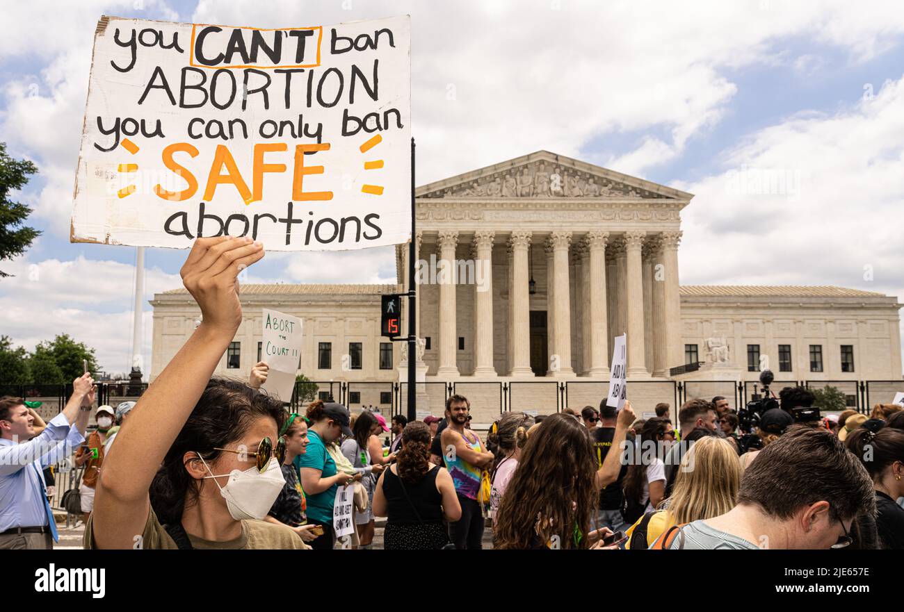 Washington, United States Of America. 24th June, 2022. 'You can't ban abortion. You can only ban SAFE abortions' reads the sign. Demonstrators assembled in front of the U.S. Supreme Court in Washington, DC on June 24, 2022 after it announced that it had eliminated the constitutional right to an abortion, overruling the 1973 Roe v. Wade decision, thereby leaving the question of abortion up to the states. (Photo by Jeff Malet). Photo via Credit: Newscom/Alamy Live News Stock Photo