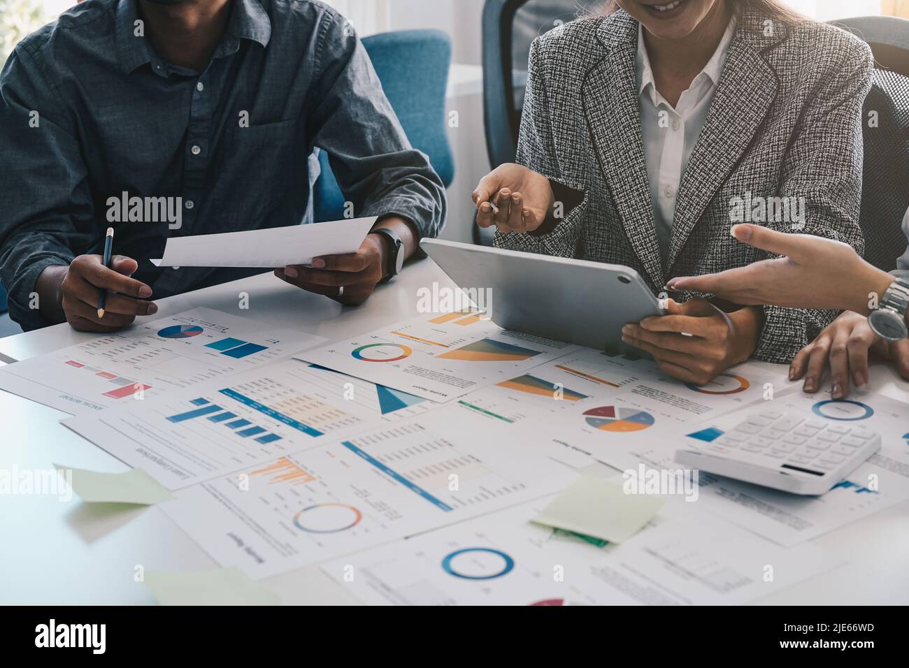 Business team brainstorming and discussing with financial data and report graph. Teamwork meeting working concept Stock Photo