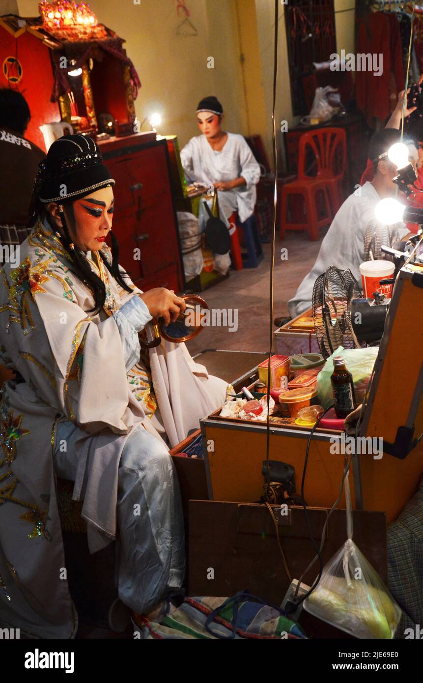 Thai act people of chinese descent makeup painting on face and wear antique acting clothes for acting playing present traditional chinese classical op Stock Photo