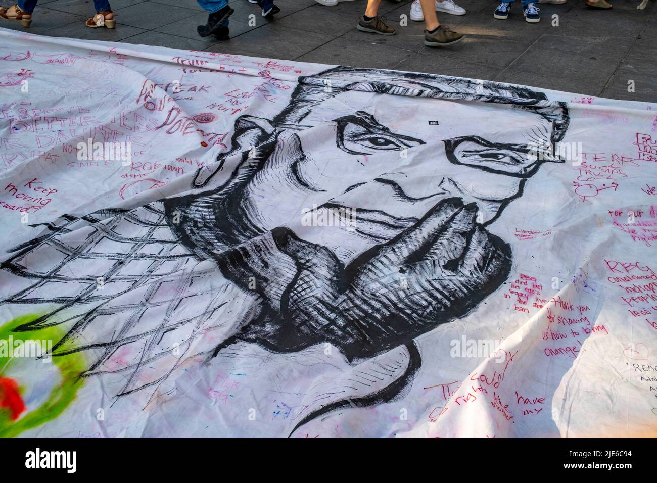 New York, New York, USA. 24th June, 2022. Thousands protested the SCOTUS repeal of Roe vs Wade in the streets of NYC and Washington Sq Park in Greenwich Village. They showed their disgust with the decision limiting a women's right to choose what they do with their own bodies. Giant portrait of Ruth Bader Ginsburg. (Credit Image: © Milo Hess/ZUMA Press Wire) Stock Photo