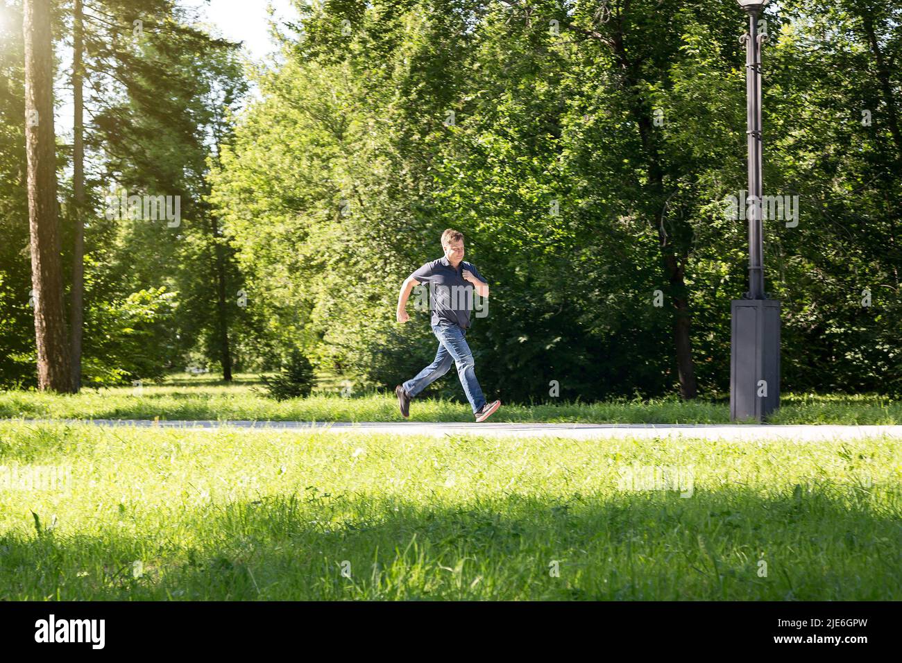 Male police officer running hi-res stock photography and images - Alamy