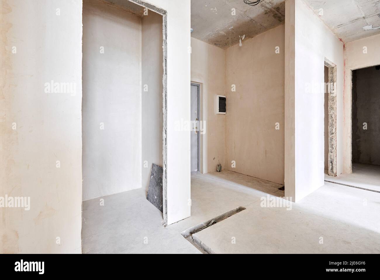 Interior of new apartment without finishing in gray tones Stock Photo ...