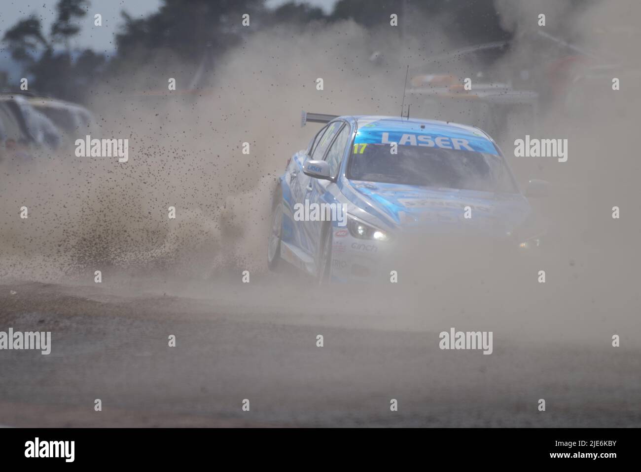 Croft, England, 25 Jun 2022. Dexter Patterson driving an Infiniti for Q50 Laser Tools Racing crashing through the gravel trap during qualifying in the Kwik Fit British Touring Car Championship. Credit: Colin Edwards/Alamy Live News. Stock Photo