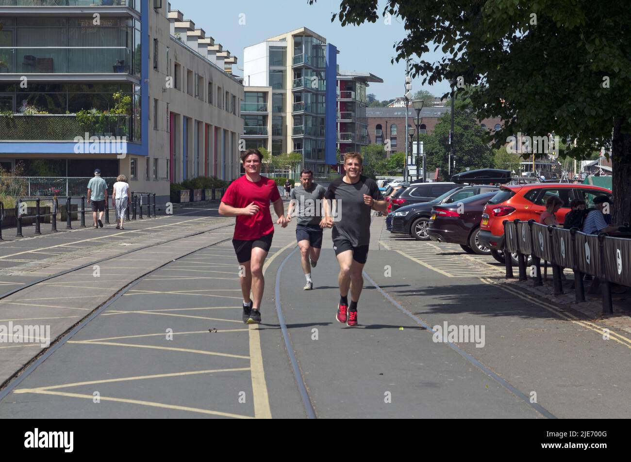 Runners near Bristol docks, Bristol City Centre running towards the camera. summer 2022 Stock Photo