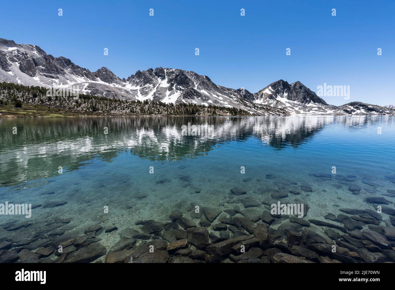 Duck Lake reflections near Mammoth Lakes in the Sierra Nevada Mountains of California. Stock Photo