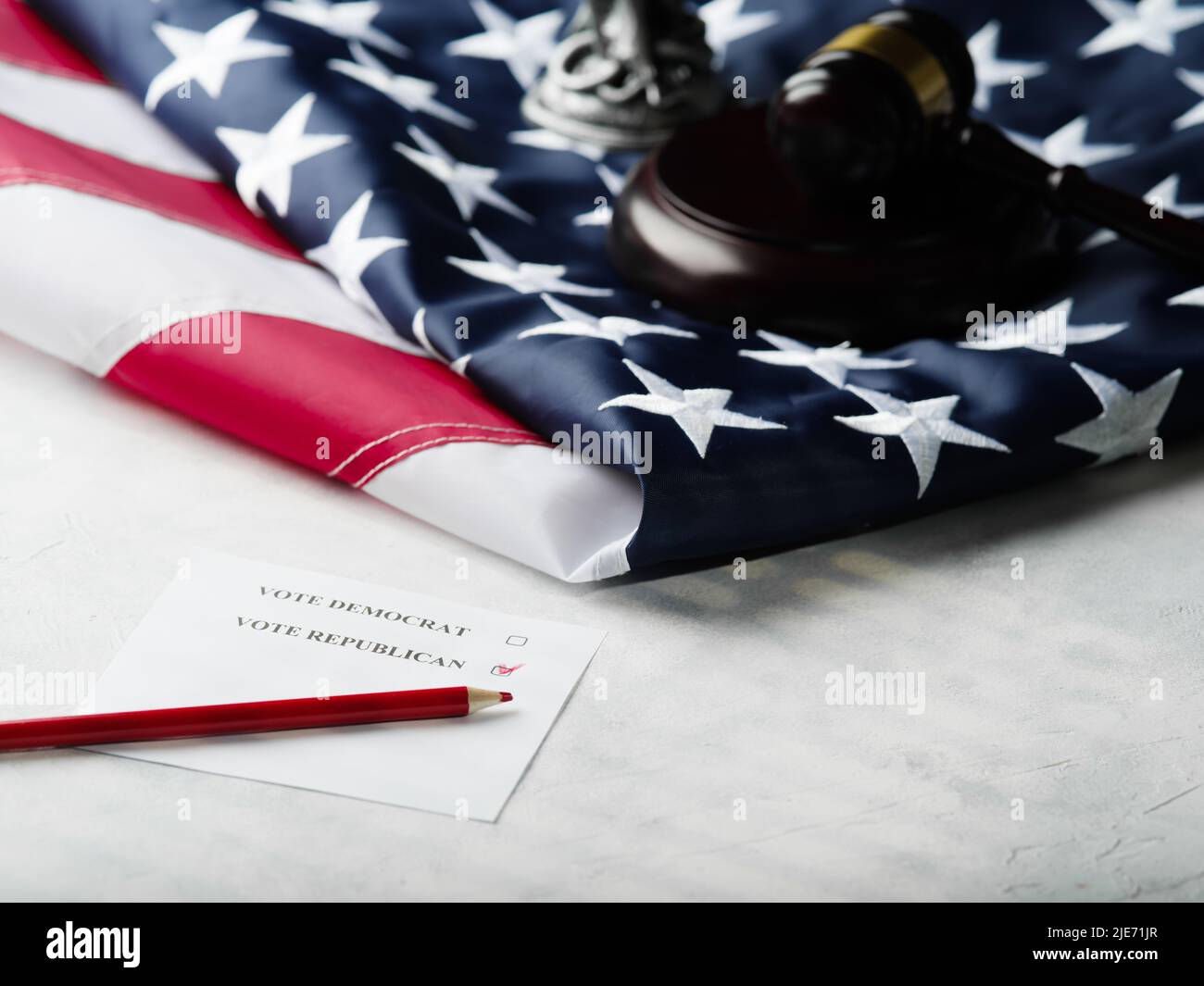 American flag, voting paper - for Democrats or Republicans, pencil and wooden mallet of the judge. Rule of law, free choice, independence, democracy. Stock Photo