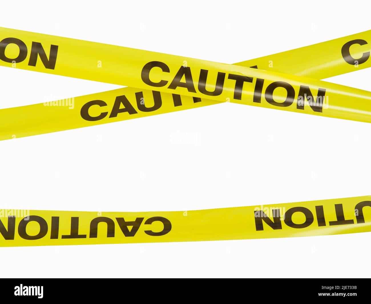 Yellow warning tapes with black inscription attention. Abstract