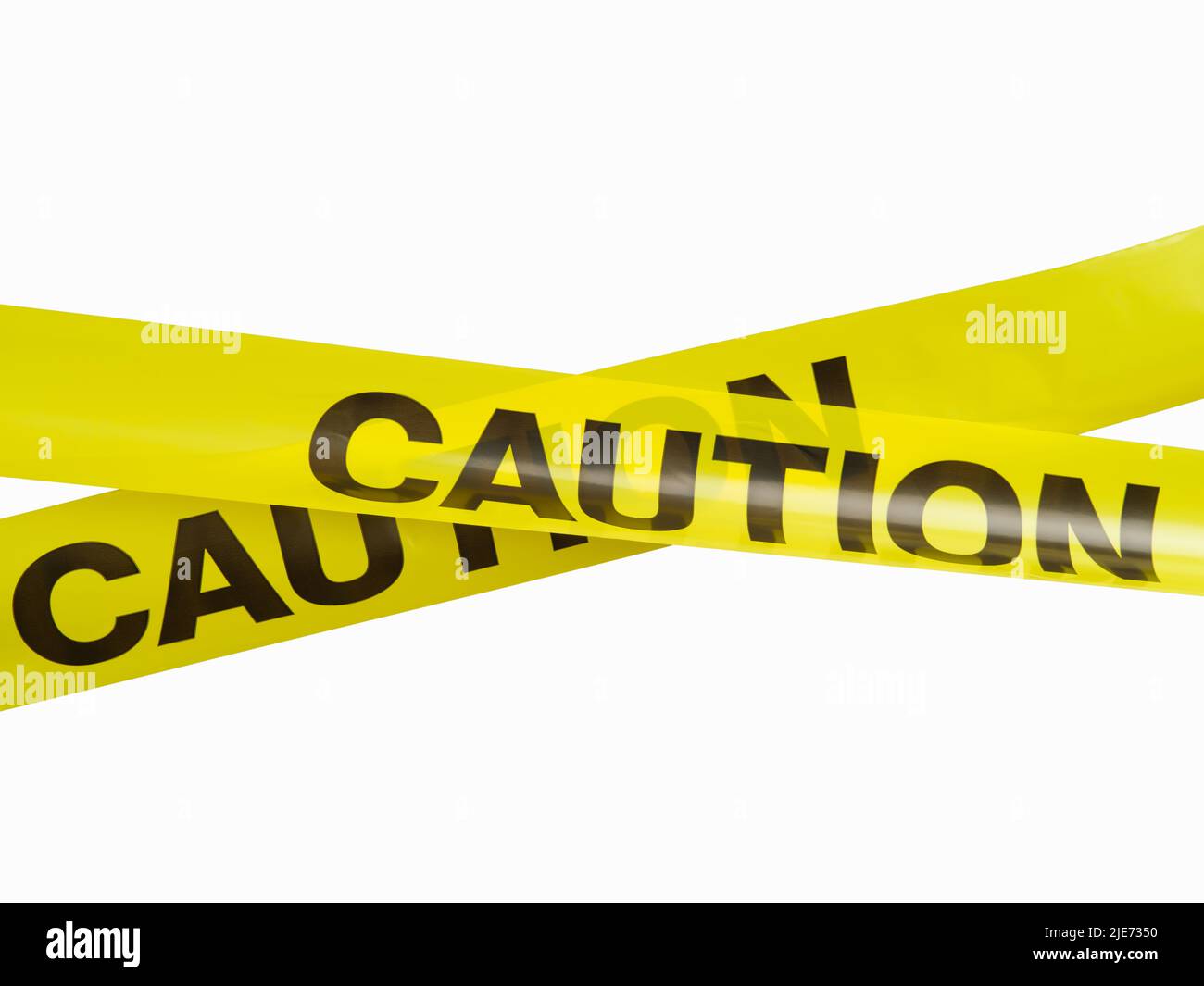 Warning yellow plastic tapes with black lettering. Restriction, barrier ...