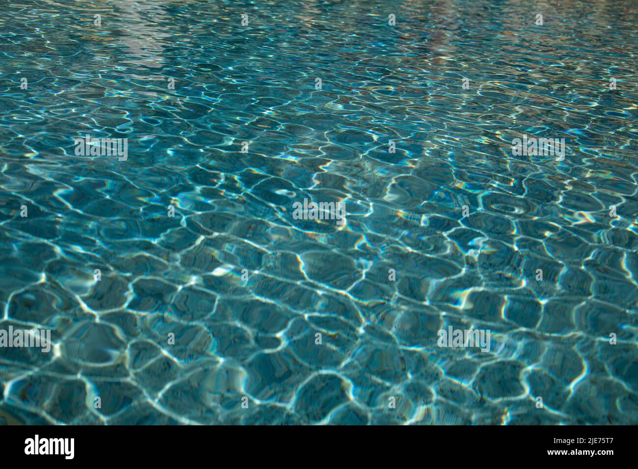blue water surface with sun reflection Stock Photo - Alamy