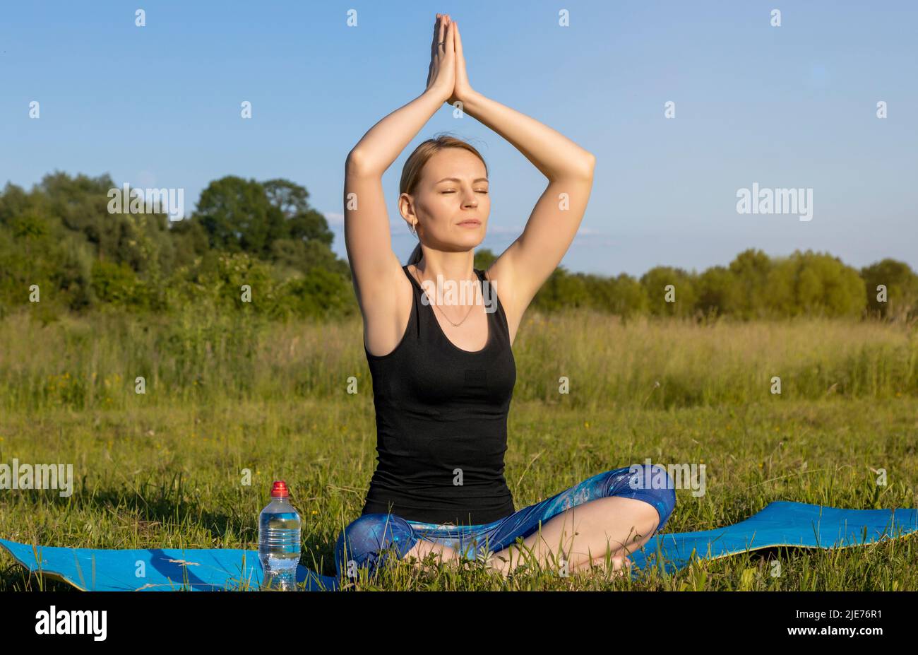 Yoga classes in the fresh air. Meditation and peace. Stock Photo