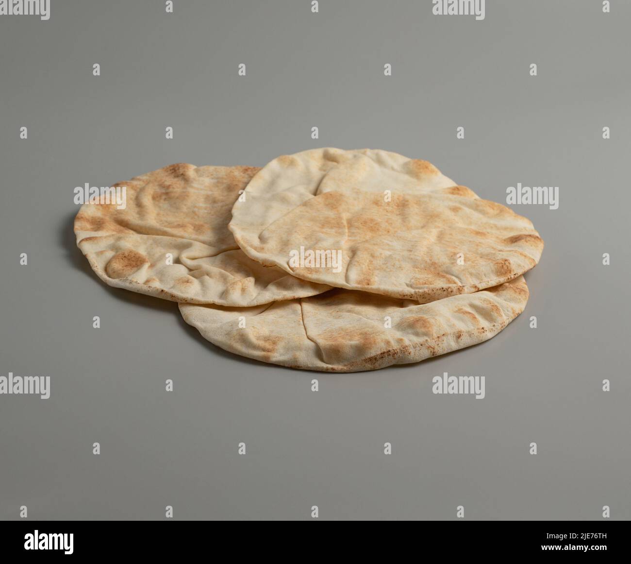 Traditional flatbread lavash on a grey background, space for text, stock photo Stock Photo