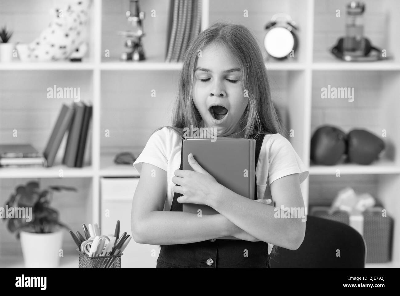 lesson for child holding copybook. schoolgirl hold notebook. back to school. childhood education. Stock Photo