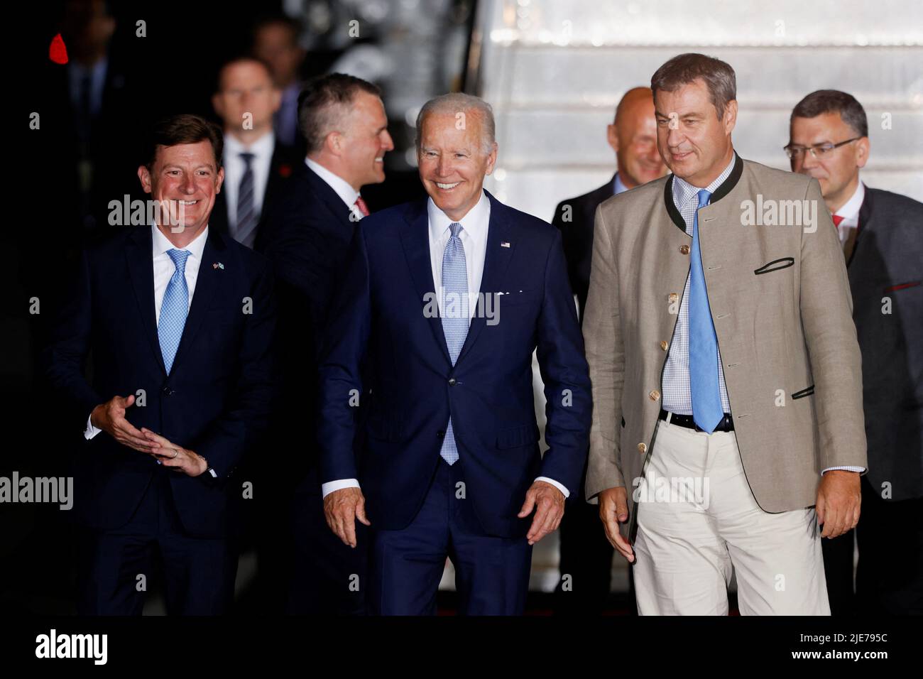 U.S. President Joe Biden walks with Bavaria's State Premier Markus Soeder as he arrives for a G7 summit at Munich International Airport near Munich, Germany June 25, 2022. REUTERS/Michaela Rehle Stock Photo
