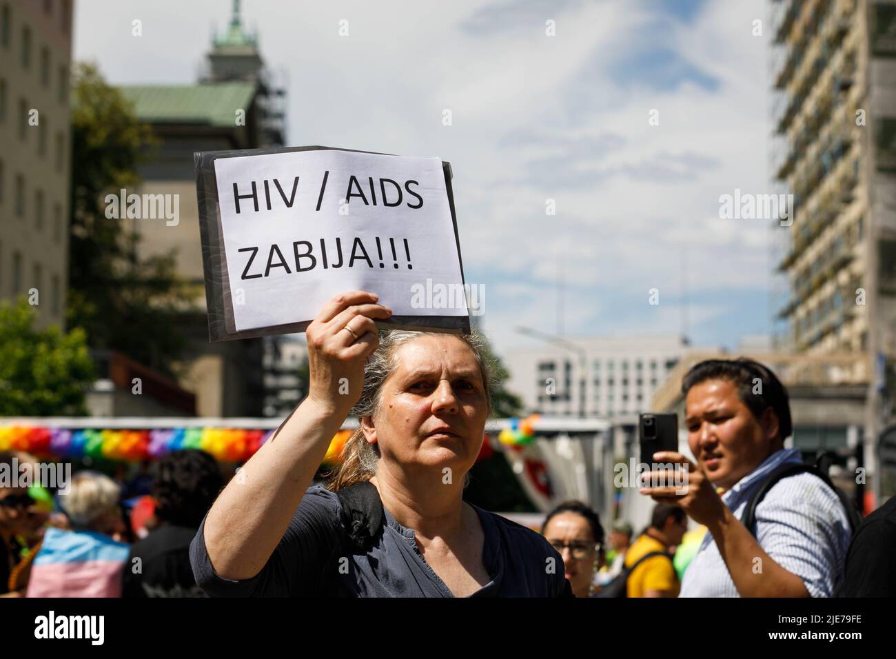 A woman provokes the participants of the Warsaw Equality Parade while ...
