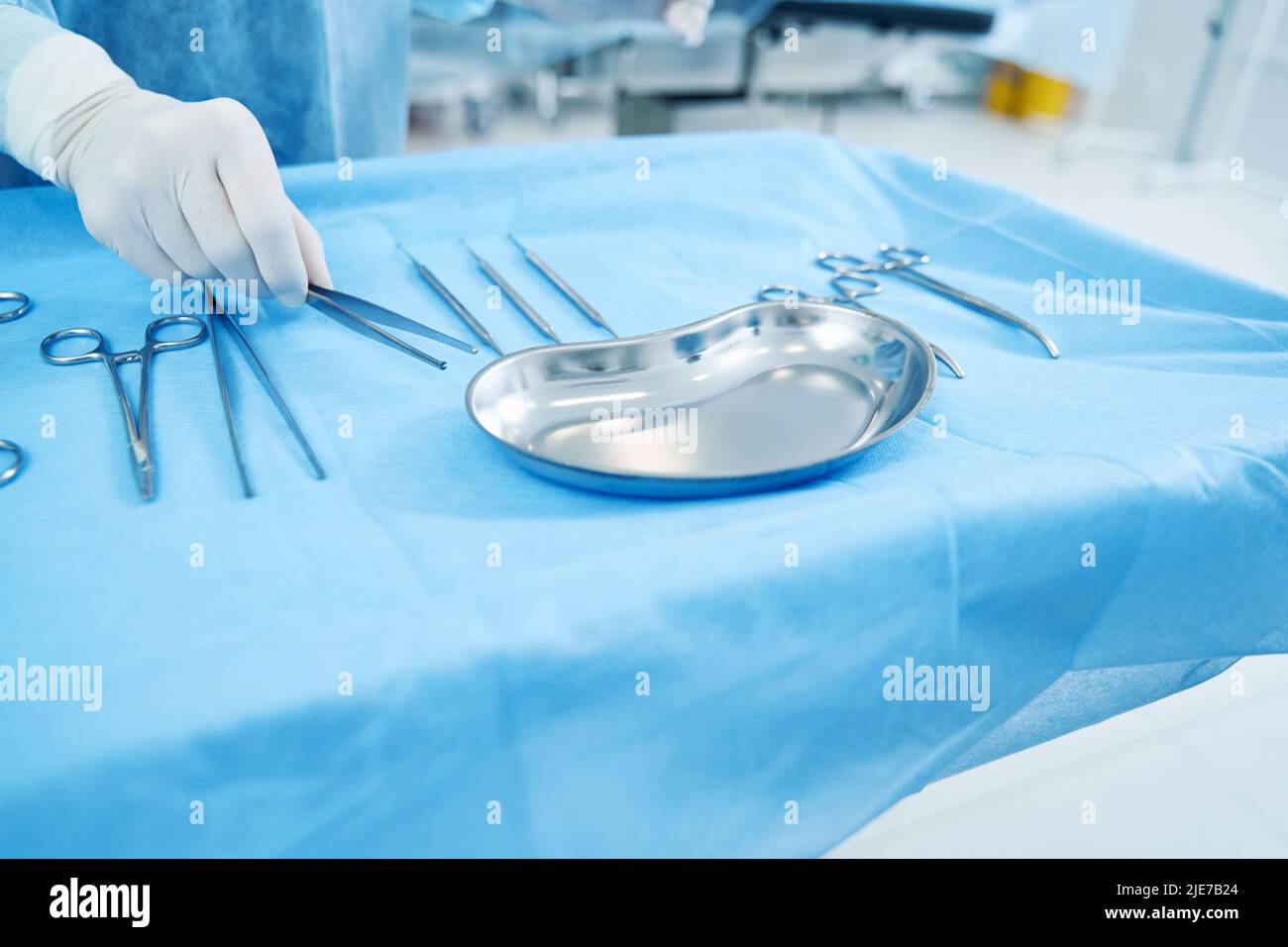 Medical worker grabbing sterile tools from the tray Stock Photo Alamy