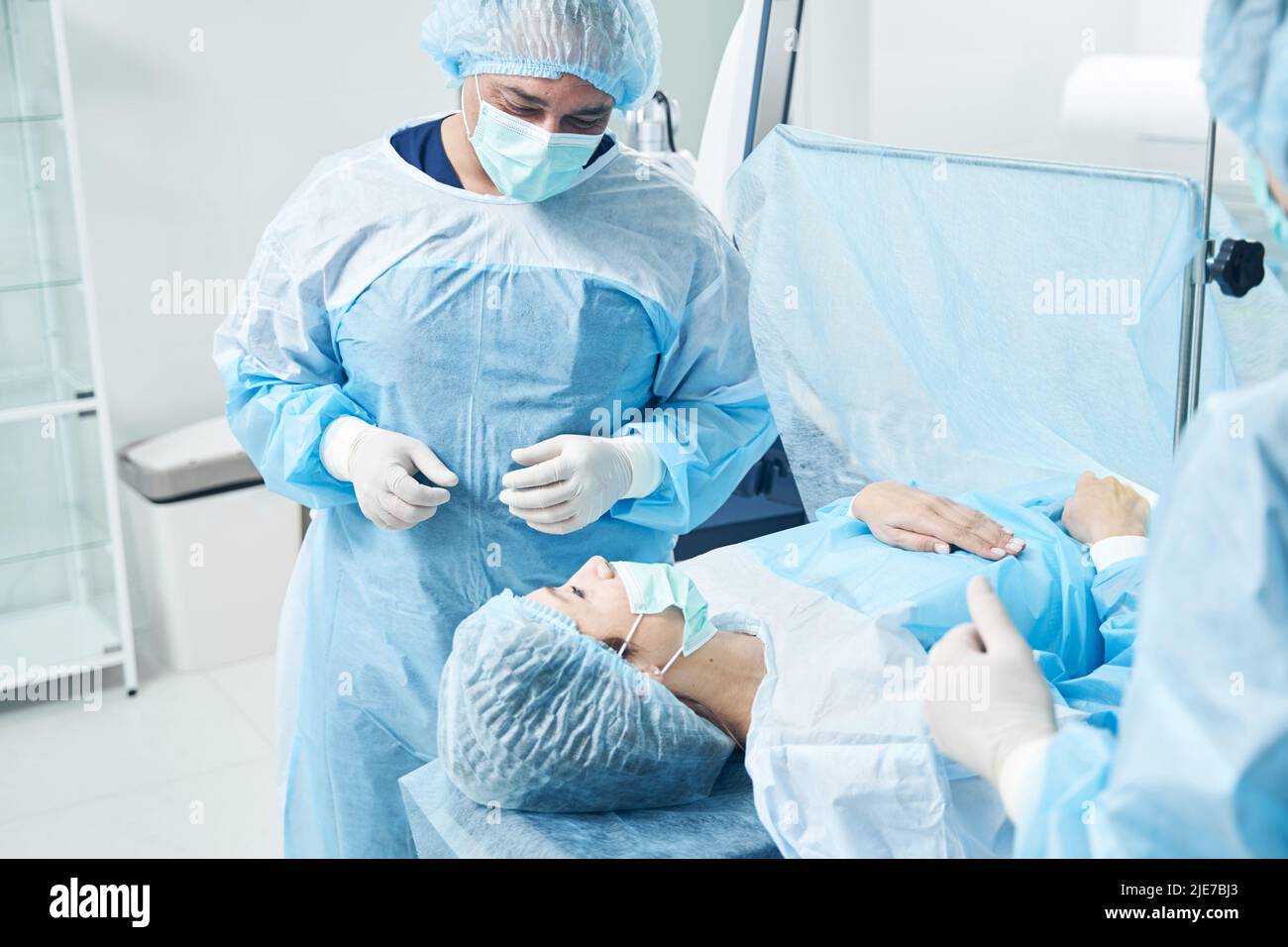 Patient and surgeon in the operating room of the hospital Stock Photo