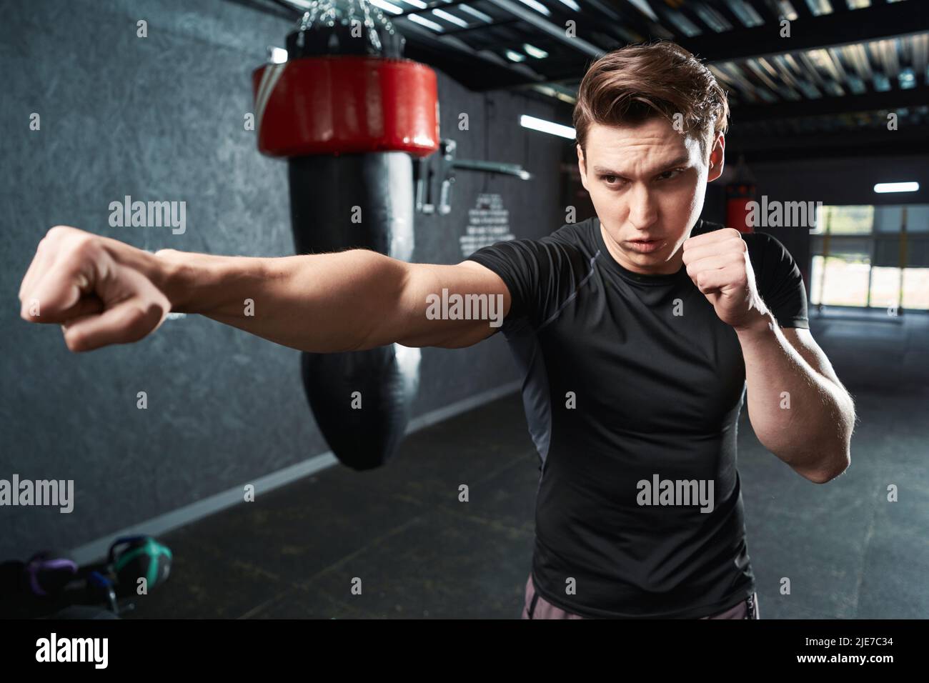 Professional sportsman shadow-boxing during gym training session Stock ...