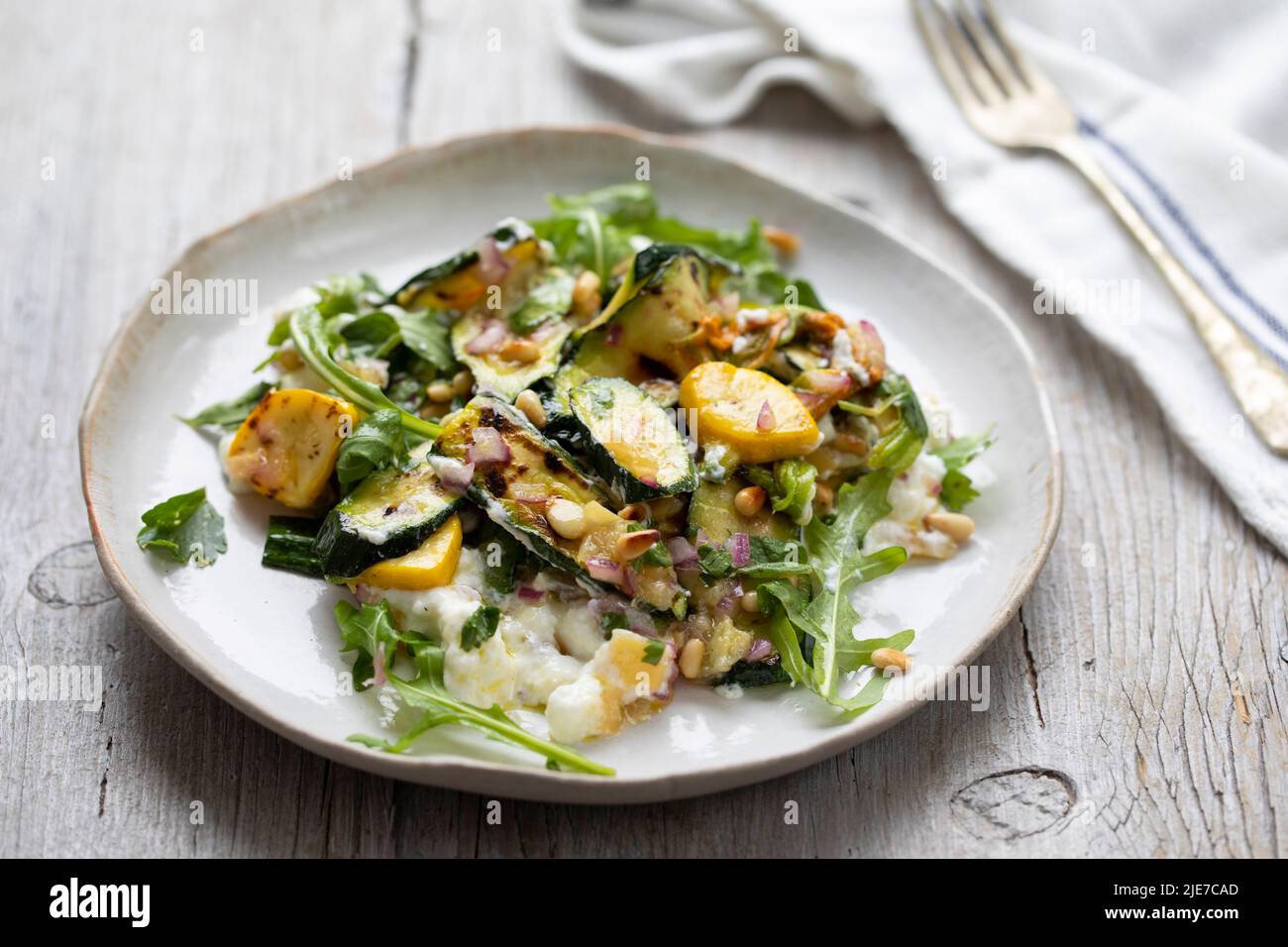 Baby courgette salad on ricotta cheese Stock Photo