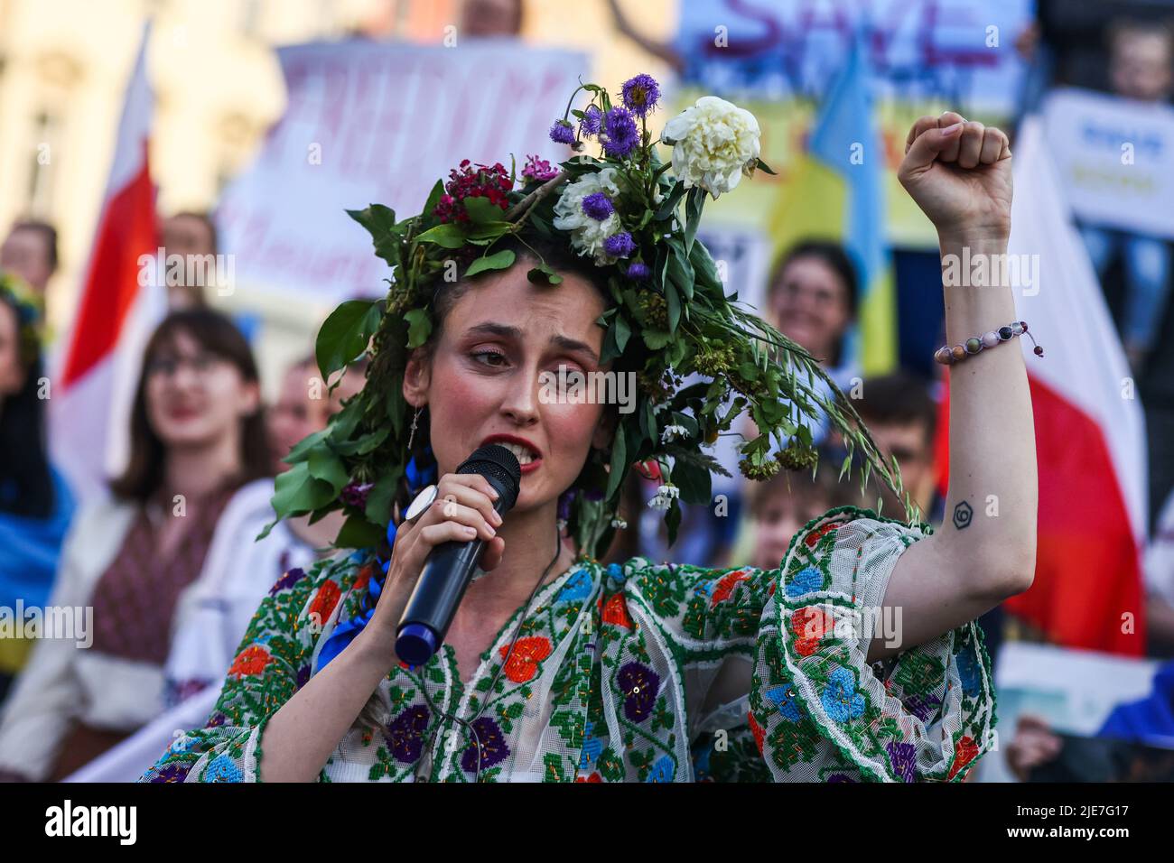 Krakow, Krakow, Poland. 25th June, 2022. An Ukrainian woman demonstrates at the Main Square in support of Azovstal 4308 regiment defenders that are currently in Russian captivity. Krakow, Poland on June 25th, 2022. Peaceful rallies were held around the world in support of more than 2,500 Azovstal prisoners of war. Credit: ZUMA Press, Inc./Alamy Live News Stock Photo