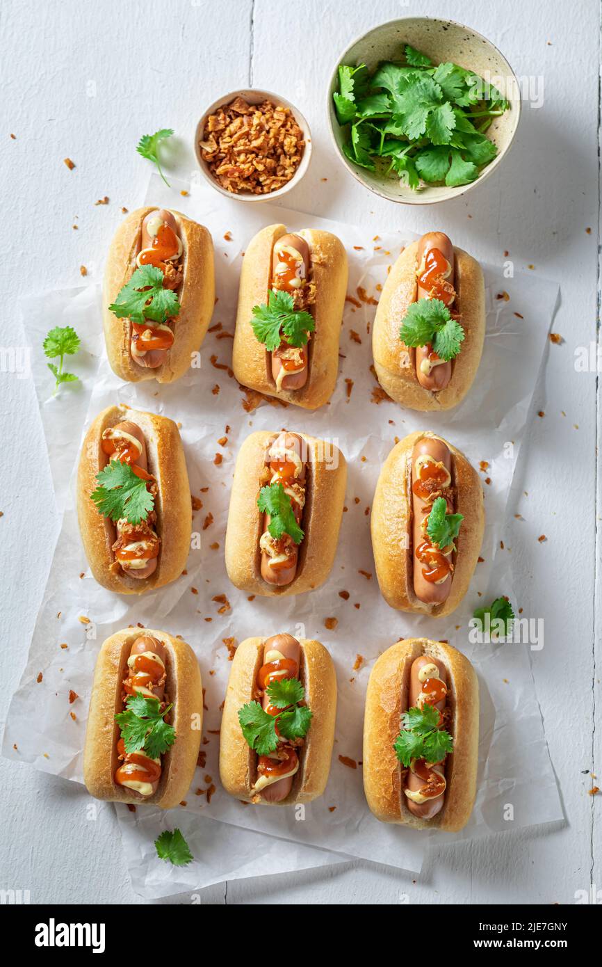 Spicy and delicious mini hot dogs with mustard and herbs. Mini hot dogs