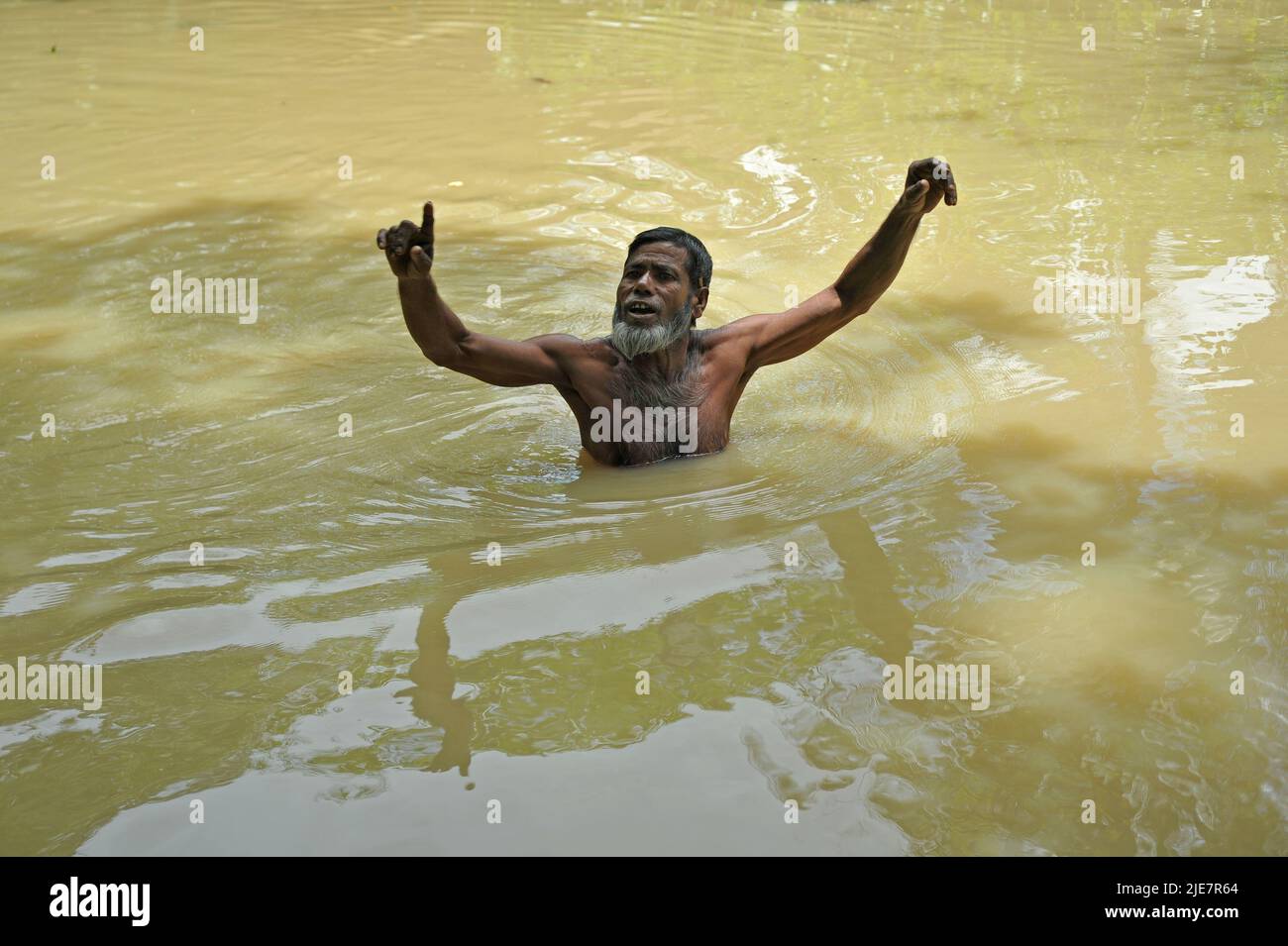 Sylhet, Mexico City, Bangladesh. 25th June, 2022. June 25, 2022, Sylhet, Bangladesh: a person swimming on the flood in the Badeswar area, The flood situation in some parts of Sylhet has worsened, with high water levels in the Kushiara River rising in the past 48 hours. According to the local office of the Bangladesh Water Development Board, the Kushiara was flowing above the danger level at various points. on June 25, 2022 in Sylhet, Bangladesh. (Credit Image: © Md Rafayat Haque Khan/eyepix via ZUMA Press Wire) Stock Photo