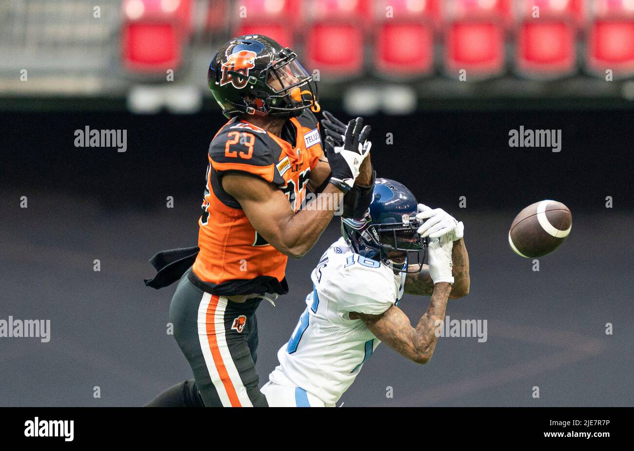 BC Lions' Delvin Breaux Sr. (left) breaks up a pass to Toronto Argonauts'  Brandon Banks during first half of CFL football action in Vancouver, B.C.,  Saturday, June 25, 2022. THE CANADIAN PRESS/Rich