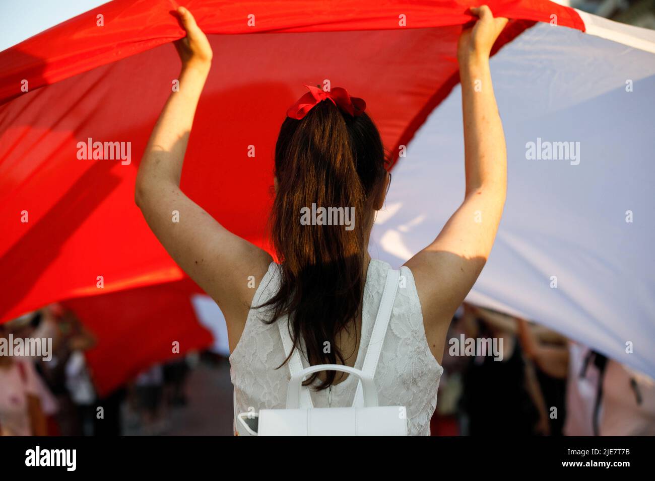Warsaw, Poland. 25th June, 2022. A young demonstrator carries a huge ...