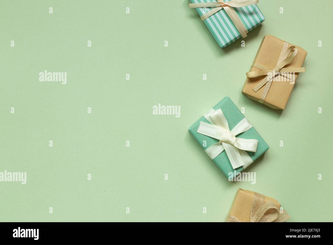 Gift boxes on green background. top view, copy space Stock Photo