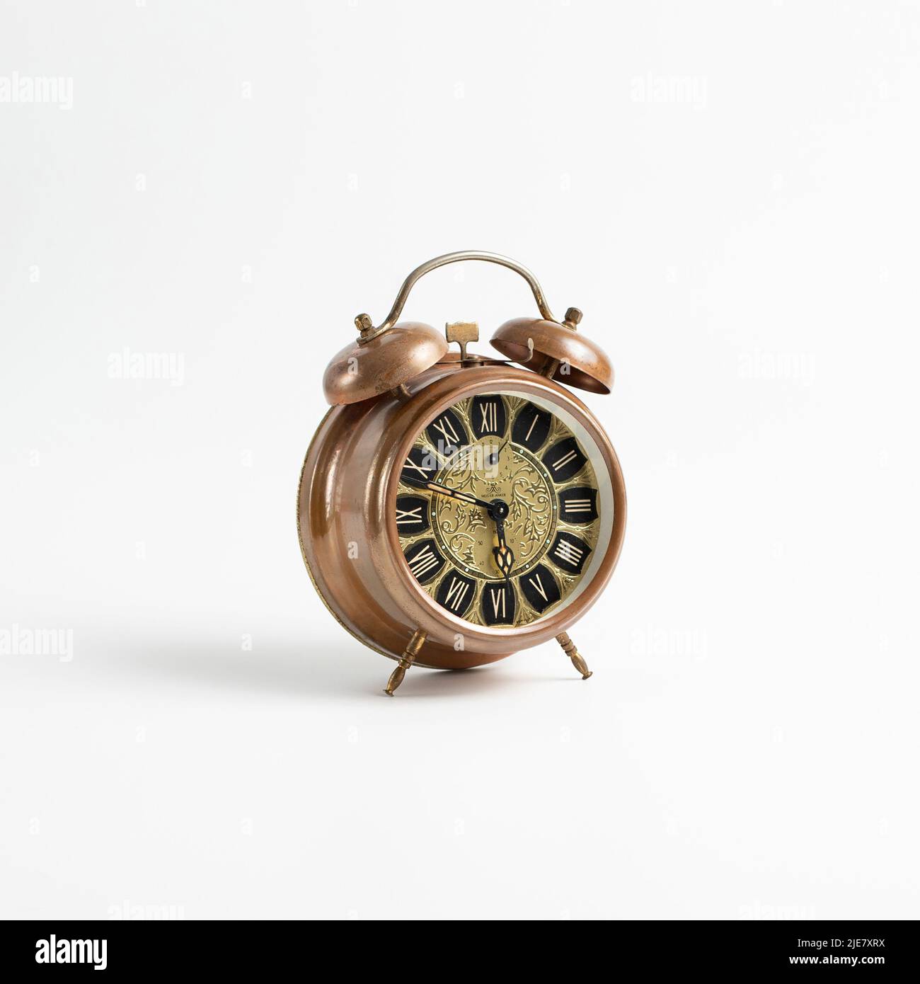 Old vintage alarm on a white background Stock Photo - Alamy