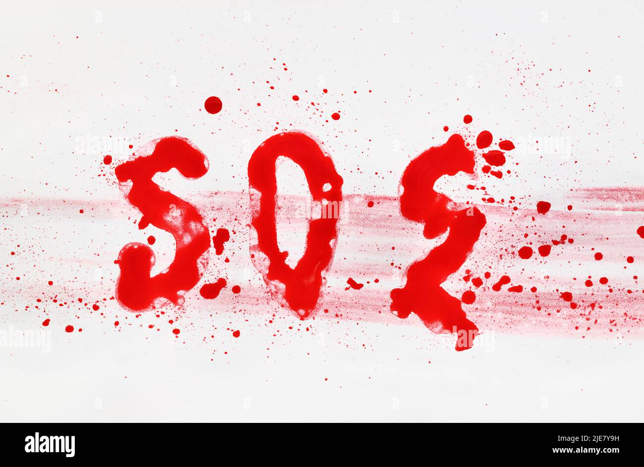 The word SOS drawn with red watercolor on white background Stock Photo