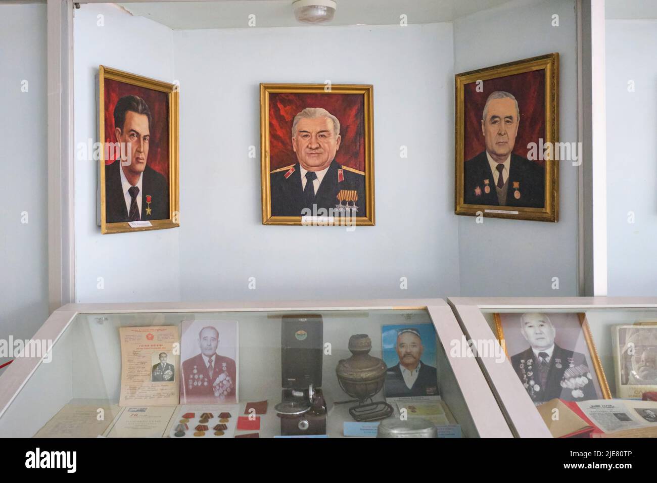 Paintings of Soviet, USSR era military officials and other memorabilia. At the Museum of History and Local Lore in Namangan, Fergana Valley, Uzbekista Stock Photo
