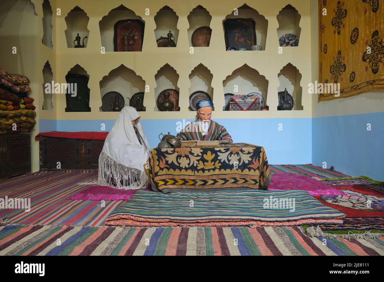 A diorama recreation of a teacher with covered student. At the Museum of History and Local Lore in Namangan, Fergana Valley, Uzbekistan. Stock Photo