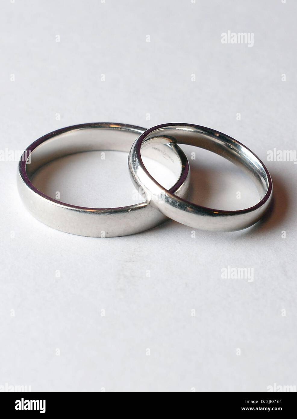 File photo dated 28/08/14 of a pair of Wedding rings, as staying up all night, travelling on public transport and wearing the same outfit on multiple occasions were among the ways people planned to save on weddings this year, a survey has found. Stock Photo