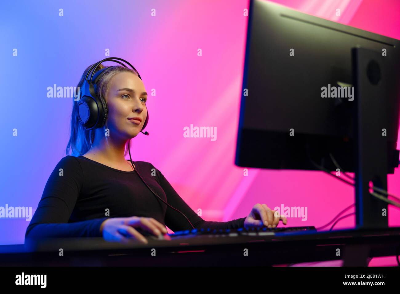 Excited Girl Gamer Sitting at the Table, Playing Online Games Stock Image -  Image of headset, esports: 136171701